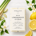 Lemongrass Citrus soy wax melts by Aroma House Miami, 3 oz clamshell surrounded by bergamot, magnolia, koa wood