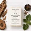 Moroccan Cedar soy wax melts by Aroma House Miami, 3 oz clamshell surrounded by vetiver, resin, spice