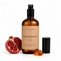 Noir Pomegranate room and linen spray by Aroma House Miami, 3.4 fl oz amber glass bottle with pomegranate, clove, cedarwood notes