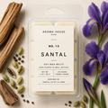 Santal soy wax melts by Aroma House Miami, 3 oz clamshell surrounded by cardamom, iris, violet